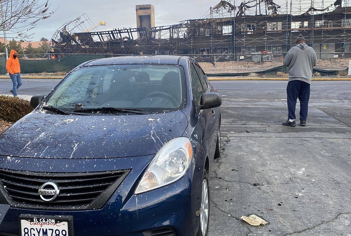 Debris from covers a car near the southwest Las Vegas scene of a Monday, Jan. 18, 2021, fire at ...