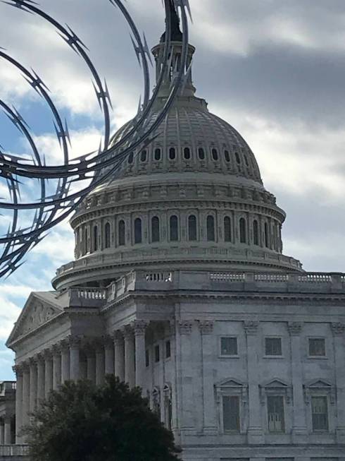 Razor wire installed atop a fence as part of security for President-elect Joe Biden's Jan. 20 i ...