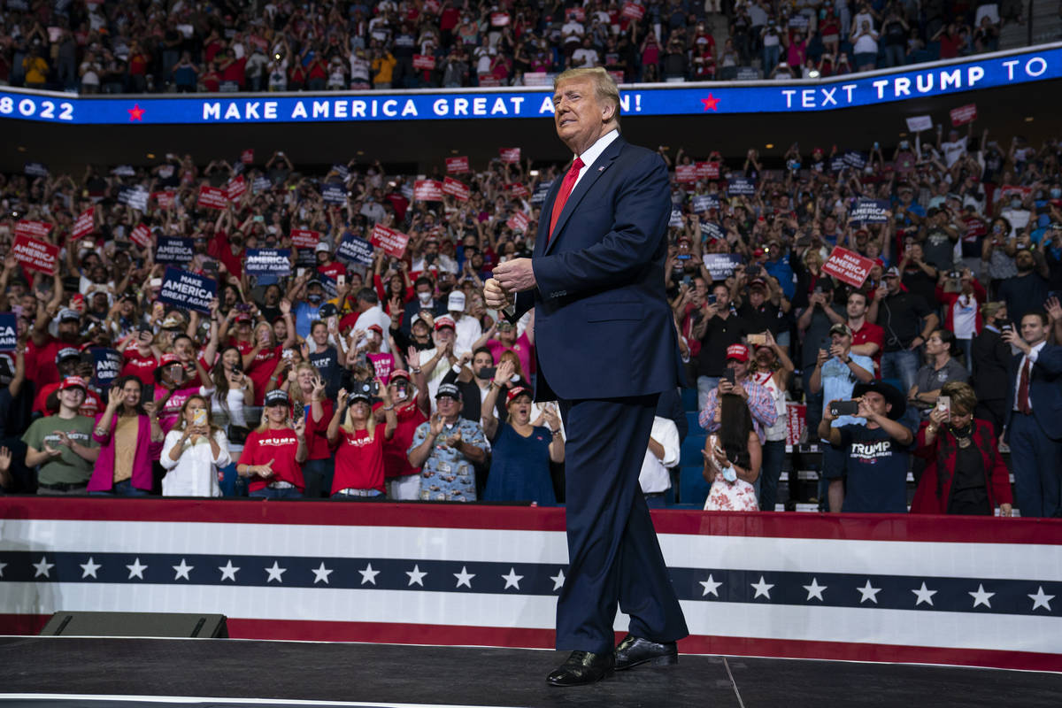 FILE - In this June 20, 2020, file photo President Donald Trump arrives on stage to speak at a ...