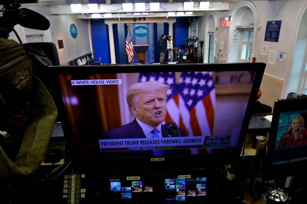 President Trump is seen on a network monitor after his pre-recorded farewell speech was release ...