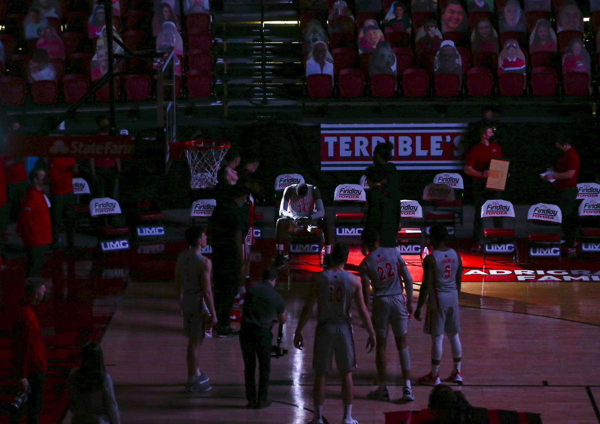 Light shines on UNLV Rebels forward Cheikh Mbacke Diong (34) as players are introduced before a ...