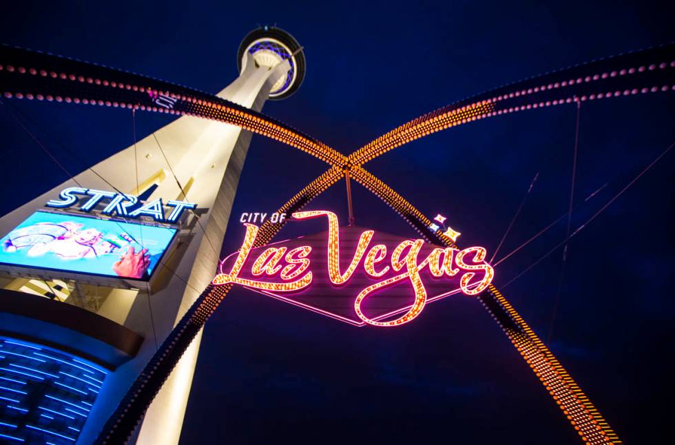 Amber lights illuminate the gateway arches in downtown Las Vegas as part of a remembrance for v ...