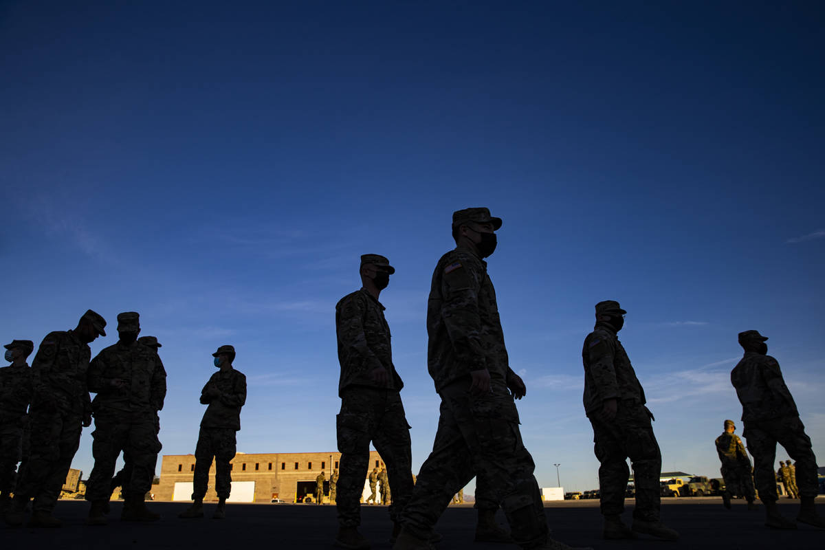 Members of the Nevada Army Guard prepare on Thursday, Jan. 14, 2021, to deploy to Washington, D ...