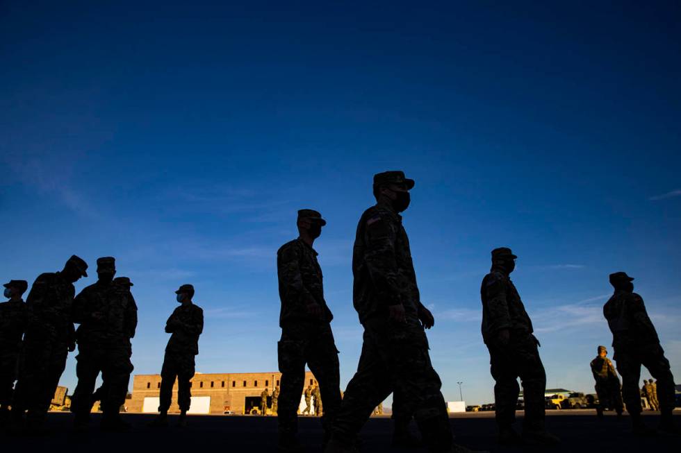 Members of the Nevada Army Guard prepare on Thursday, Jan. 14, 2021, to deploy to Washington, D ...