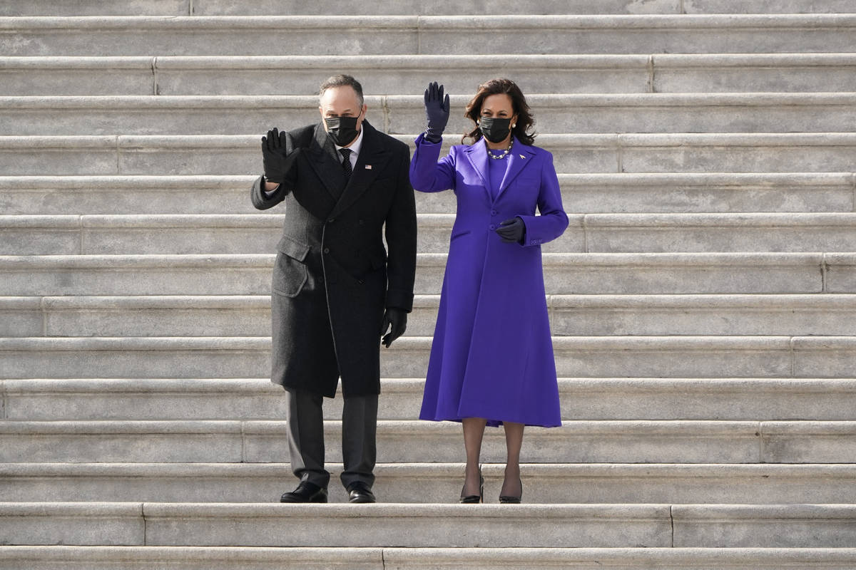 Vice President Kamala Harris and her husband Doug Emhoff wave as former Vice President Mike Pen ...