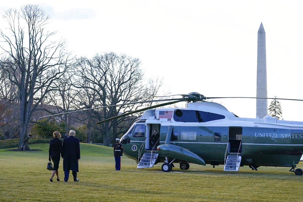 President Donald Trump and first lady Melania Trump walk to board Marine One on the South Lawn ...