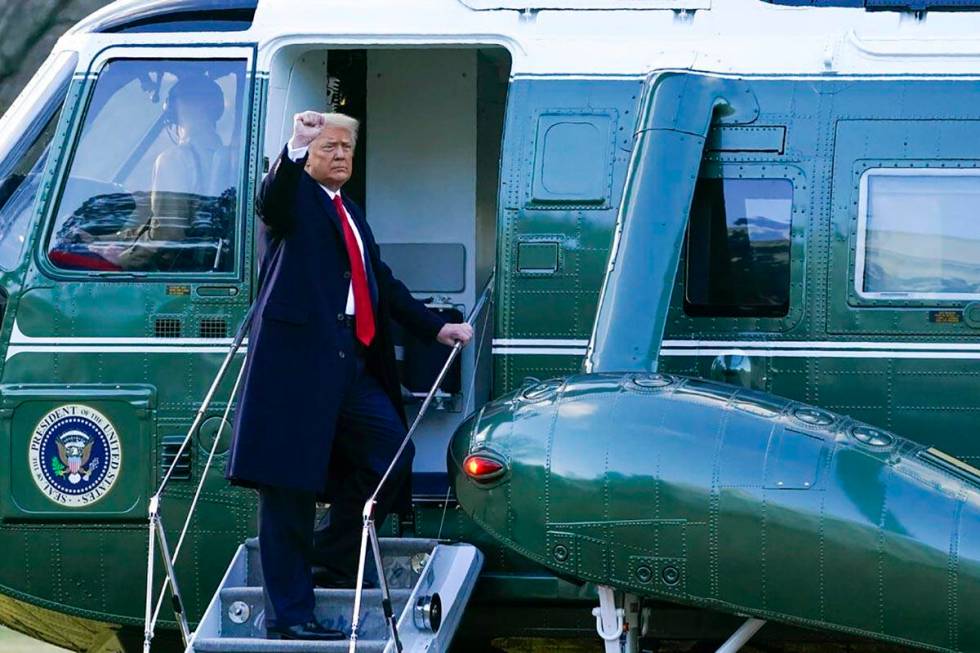 President Donald Trump gestures as he boards Marine One on the South Lawn of the White House, W ...