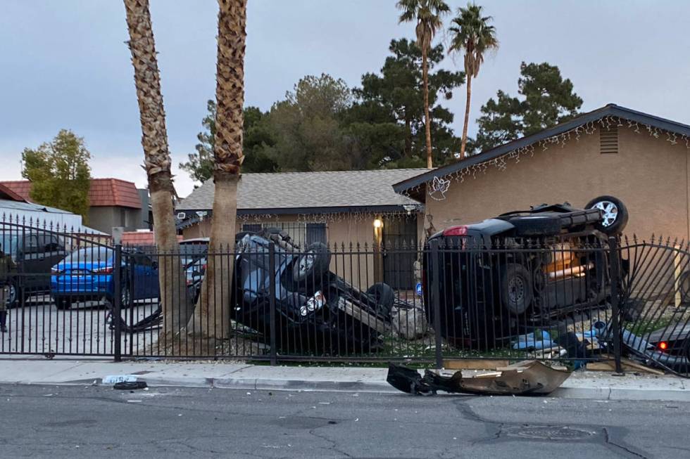 Las Vegas police are trying to determine how two vehicles ended up overturned in the front yard ...