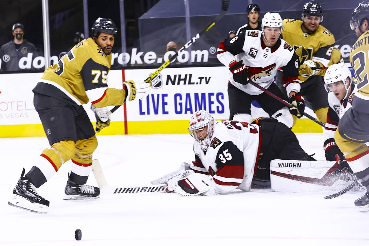 Golden Knights right wing Ryan Reaves (75) eyes the puck after a block by Arizona Coyotes goalt ...