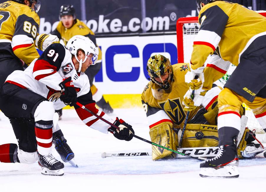 Golden Knights goaltender Marc-Andre Fleury (29) blocks the puck in front of Arizona Coyotes ce ...