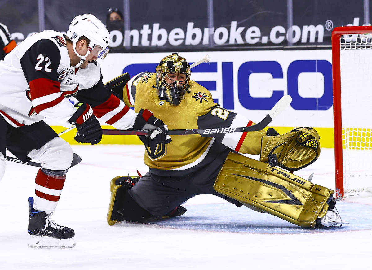 Golden Knights goaltender Marc-Andre Fleury (29) blocks the puck in front of Arizona Coyotes le ...