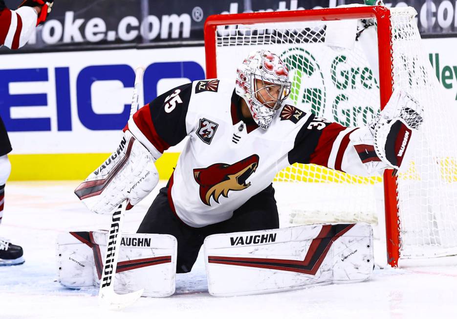 Arizona Coyotes goaltender Darcy Kuemper (35) makes a save against the Golden Knights during th ...