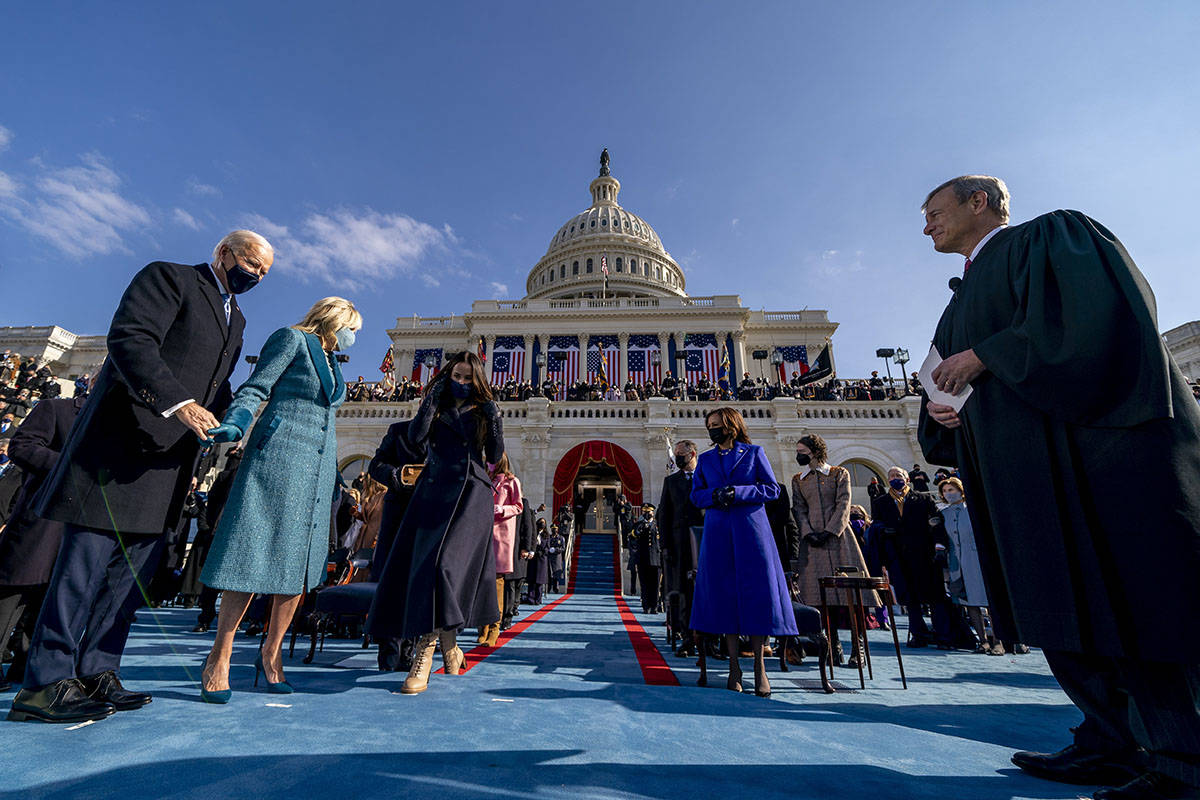 Joe Biden takes the stage to be sworn in as the 46th president of the United States by Chief Ju ...