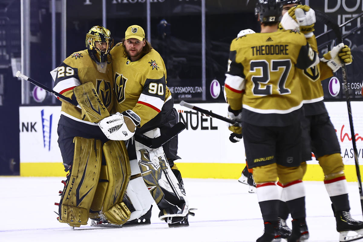 Golden Knights goaltenders Marc-Andre Fleury (29) and Robin Lehner (90) celebrate after their o ...