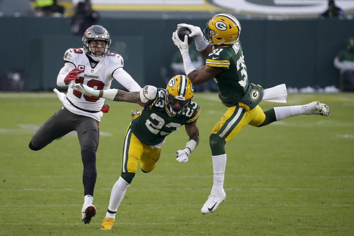 Green Bay Packers' Adrian Amos (31) intercepts a pass intended for Tampa Bay Buccaneers' Mike E ...