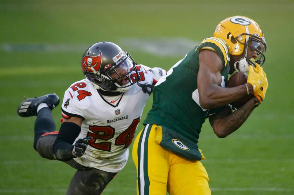 Green Bay Packers' Marquez Valdes-Scantling pulls in a 50-yard touchdown pass against Tampa Bay ...
