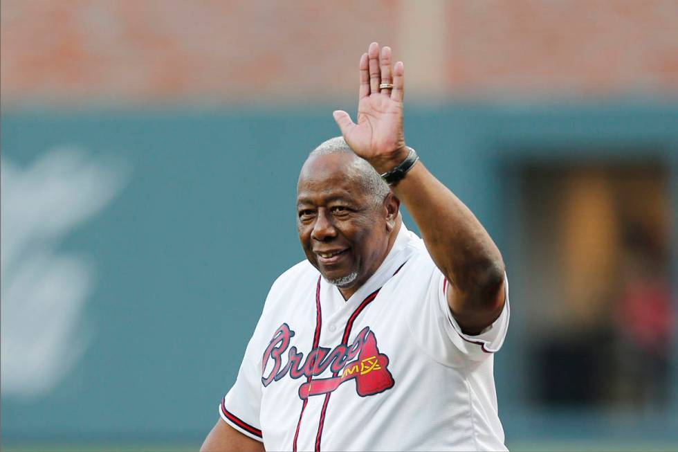 Former Atlanta Braves' Hank Aaron is honored during a ceremony before a baseball game between t ...