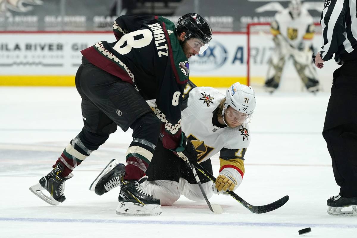 Arizona Coyotes center Nick Schmaltz (8) and Vegas Golden Knights center William Karlsson (71) ...