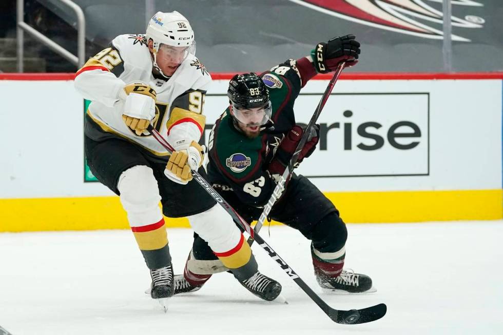 Vegas Golden Knights left wing Tomas Nosek (92) controls the puck in front of Arizona Coyotes r ...