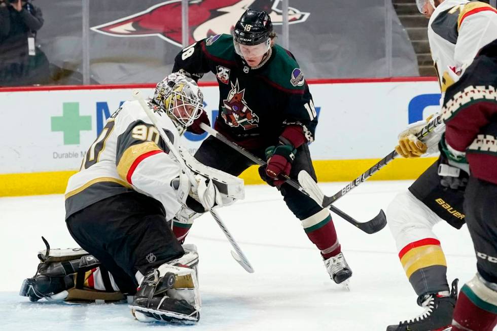 Vegas Golden Knights goaltender Robin Lehner (90) makes a save on a shot by Arizona Coyotes cen ...