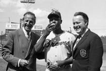 FILE- In this May 17, 1970, file photo Atlanta Braves' Hank Aaron, center, poses for photos aft ...
