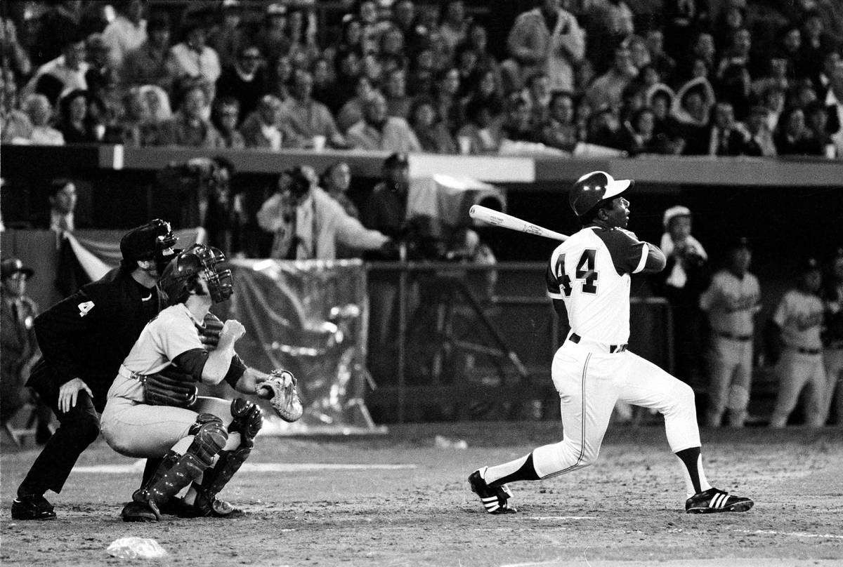 Atlanta Braves' Hank Aaron (44) breaks Babe Ruth's record for career home runs as he hits his 7 ...