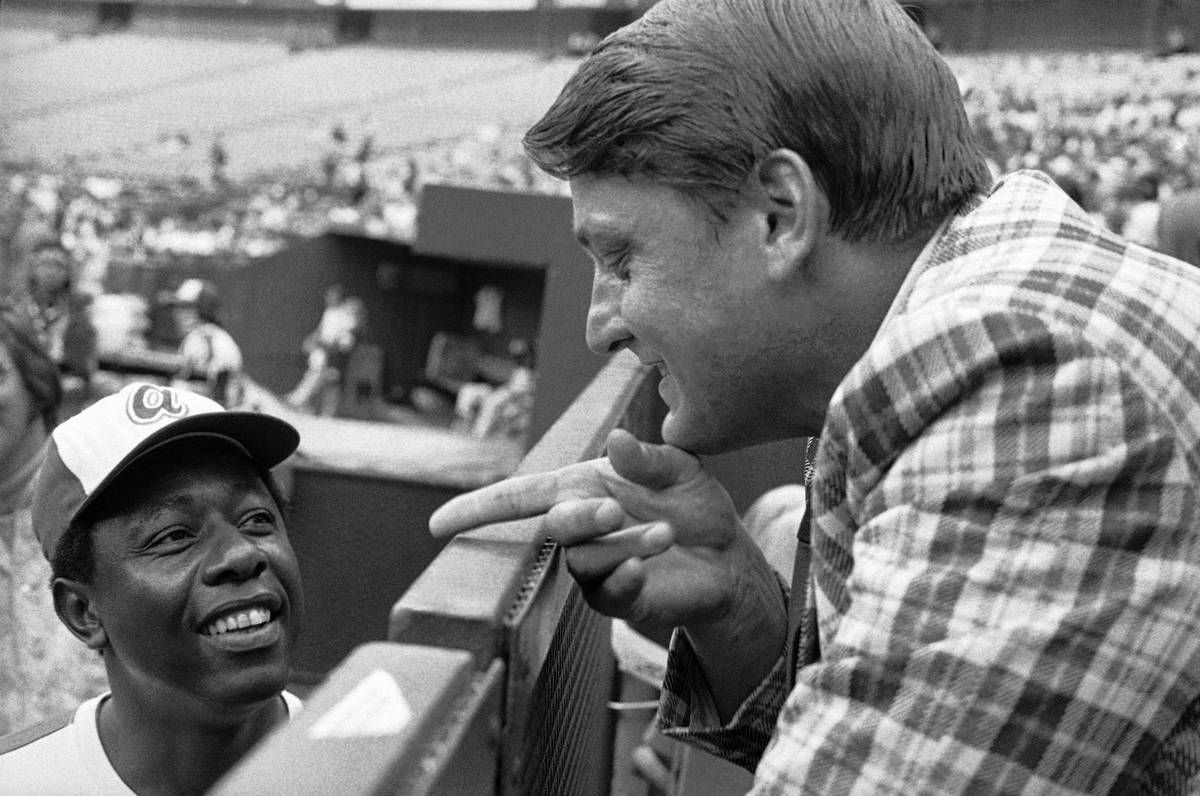 Former Yankee star Roger Maris talks with Hank Aaron on July 17, 1973, in Atlanta. Maris says h ...