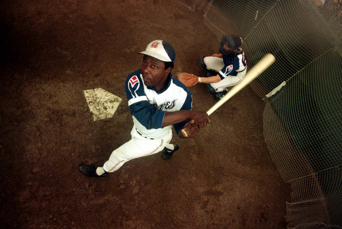 FILE- In this March 1974 file photo, Atlanta Braves outfielder Hank Aaron swings a bat at home ...