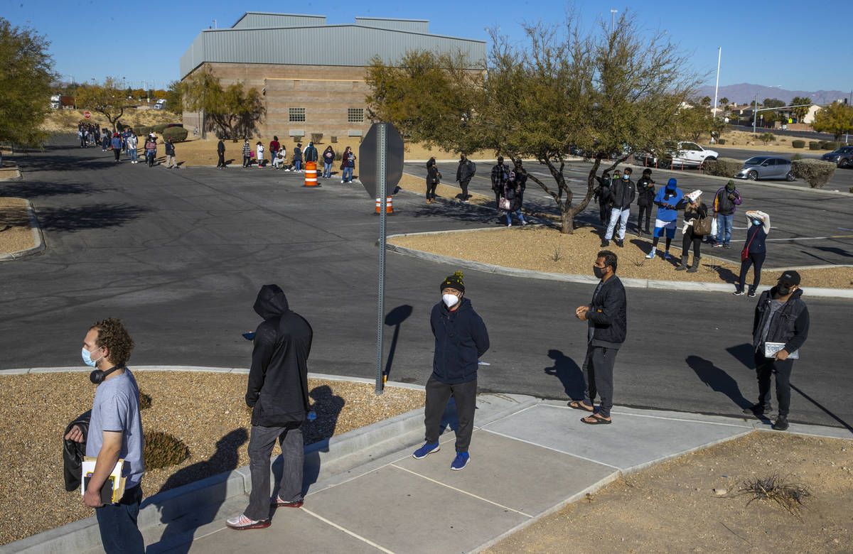 Long lines of people form regularly around the parking lot outside the Nevada Department of Mot ...