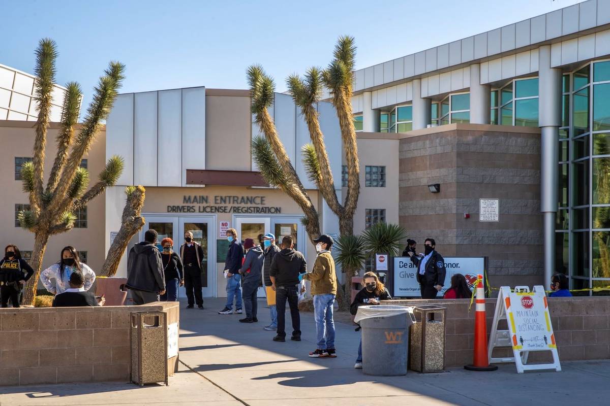 Long lines of people form regularly outside the Nevada Department of Motor Vehicles on West. Fl ...