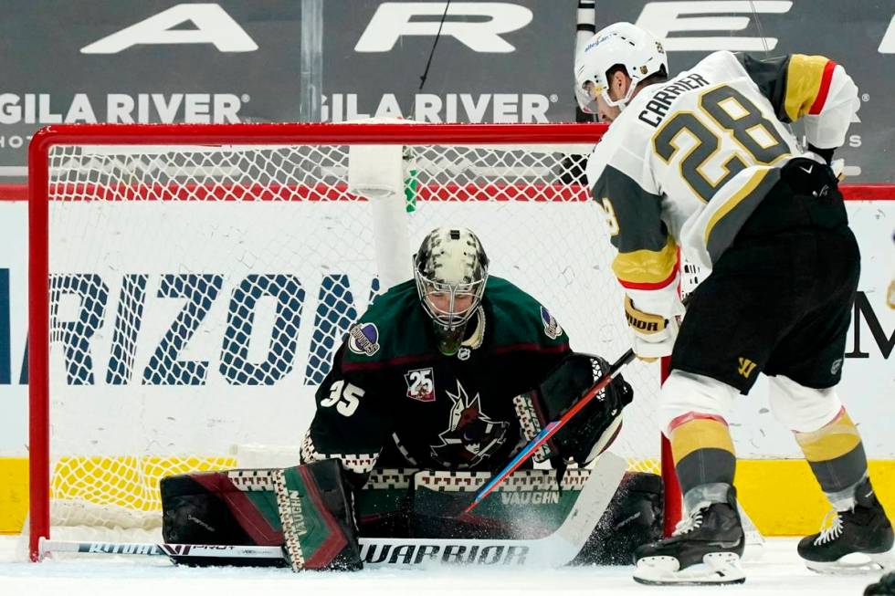Arizona Coyotes goaltender Darcy Kuemper (35) makes a save on a shot by Vegas Golden Knights le ...