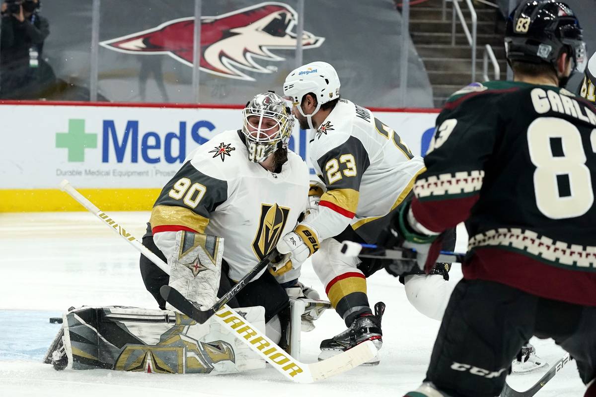 Arizona Coyotes right wing Conor Garland (83) scores a goal against Vegas Golden Knights goalte ...
