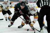 Arizona Coyotes left wing Johan Larsson (22) and Vegas Golden Knights center William Karlsson ( ...