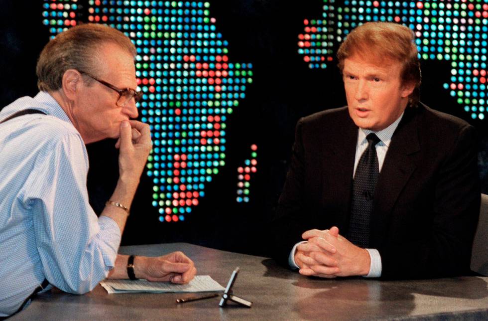 FILE - In this Oct. 7, 1999 file photo, Donald Trump, right, is interviewed by Larry King durin ...
