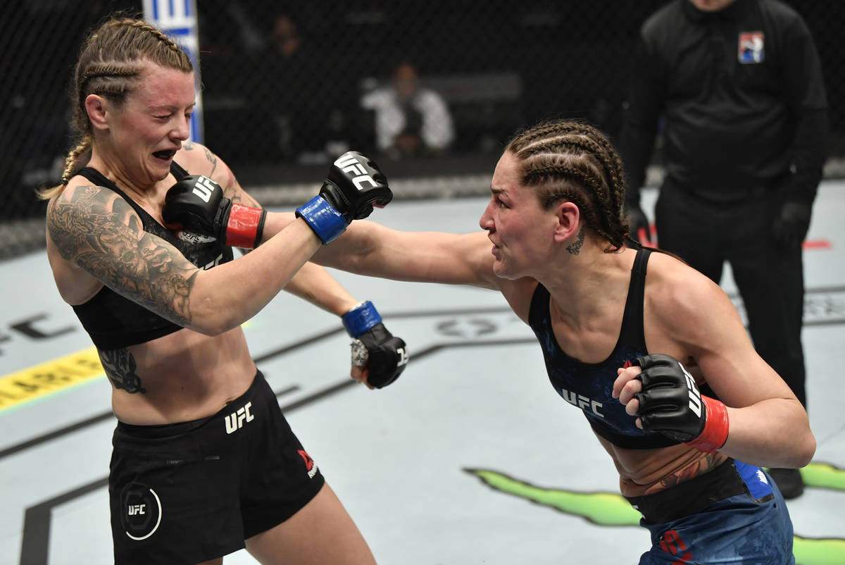 ABU DHABI, UNITED ARAB EMIRATES - JANUARY 23: (R-L) Jessica Eye punches Joanne Calderwood of Sc ...