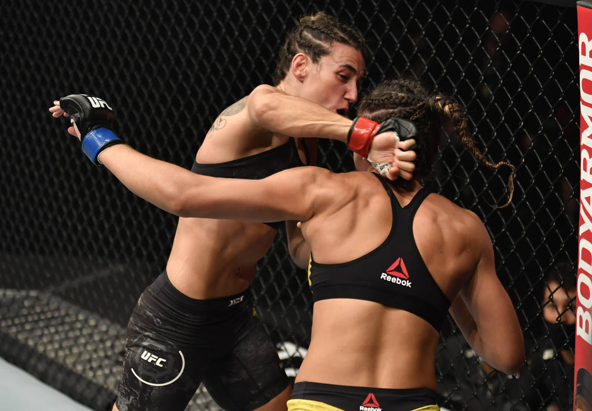 ABU DHABI, UNITED ARAB EMIRATES - JANUARY 23: (L-R) Marina Rodriguez of Brazil punches Amanda R ...