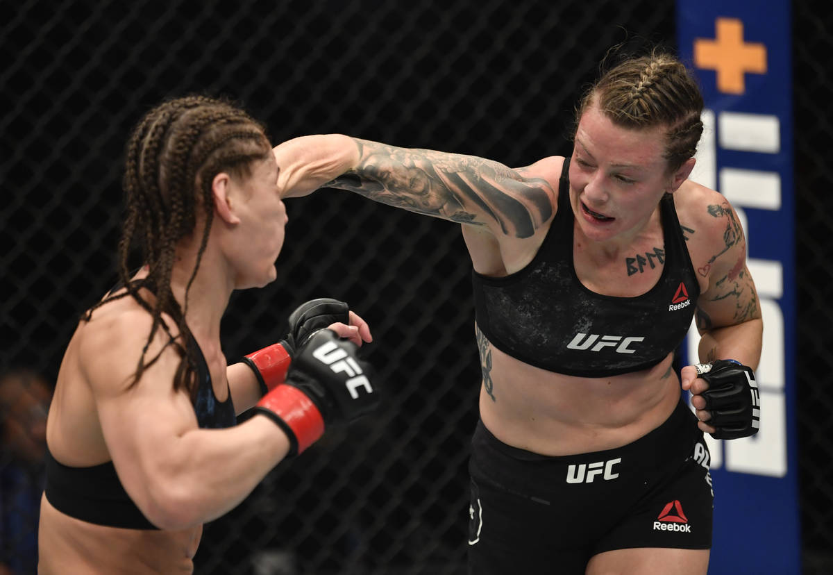 ABU DHABI, UNITED ARAB EMIRATES - JANUARY 23: (R-L) Joanne Calderwood of Scotland punches Jessi ...