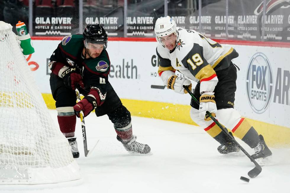 Vegas Golden Knights right wing Reilly Smith (19) skates with puck in front of Arizona Coyotes ...