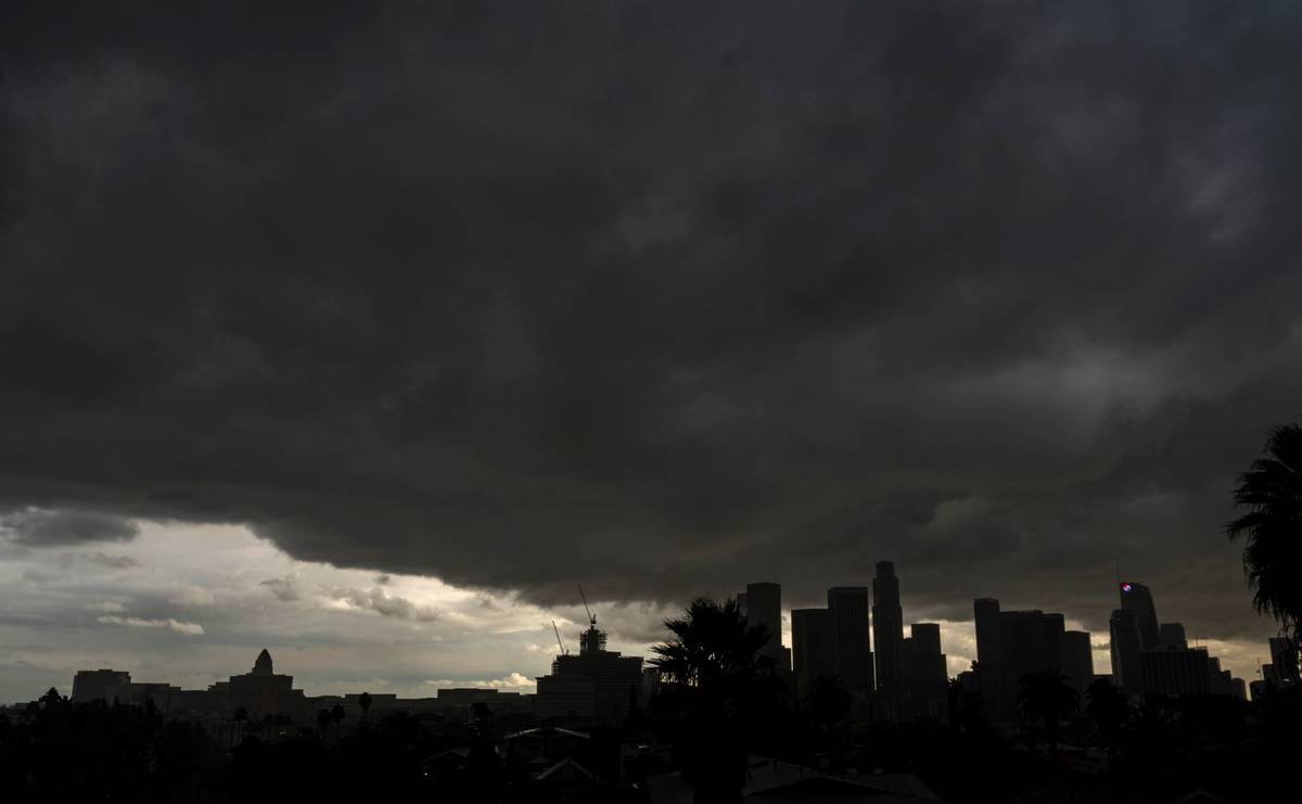 Heavy clouds move over Los Angeles city skyline Saturday, Jan. 23, 2021. (AP Photo/Damian Dovar ...