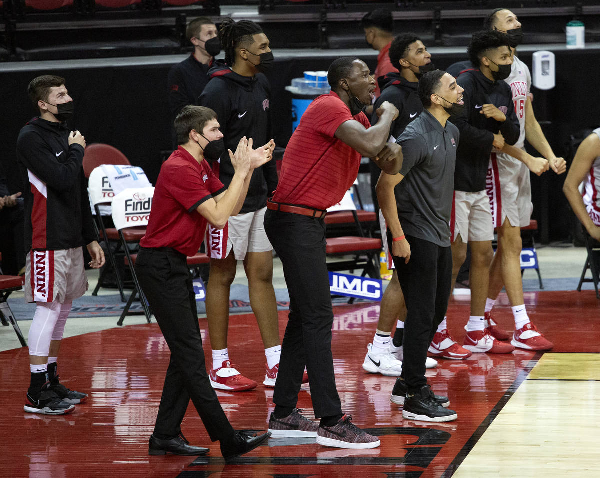 UNLV's coaching staff encourages the team during the second half of a basketball game against t ...