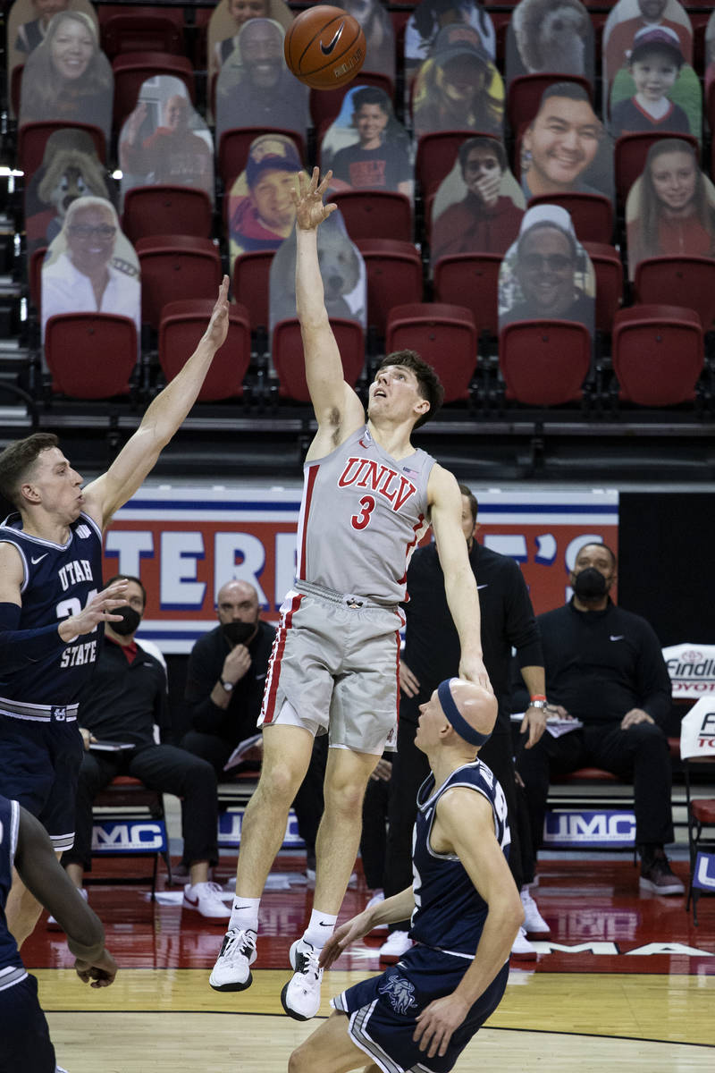 UNLV's guard Caleb Grill (3) attempts to shoot a point during the second half of a basketball g ...