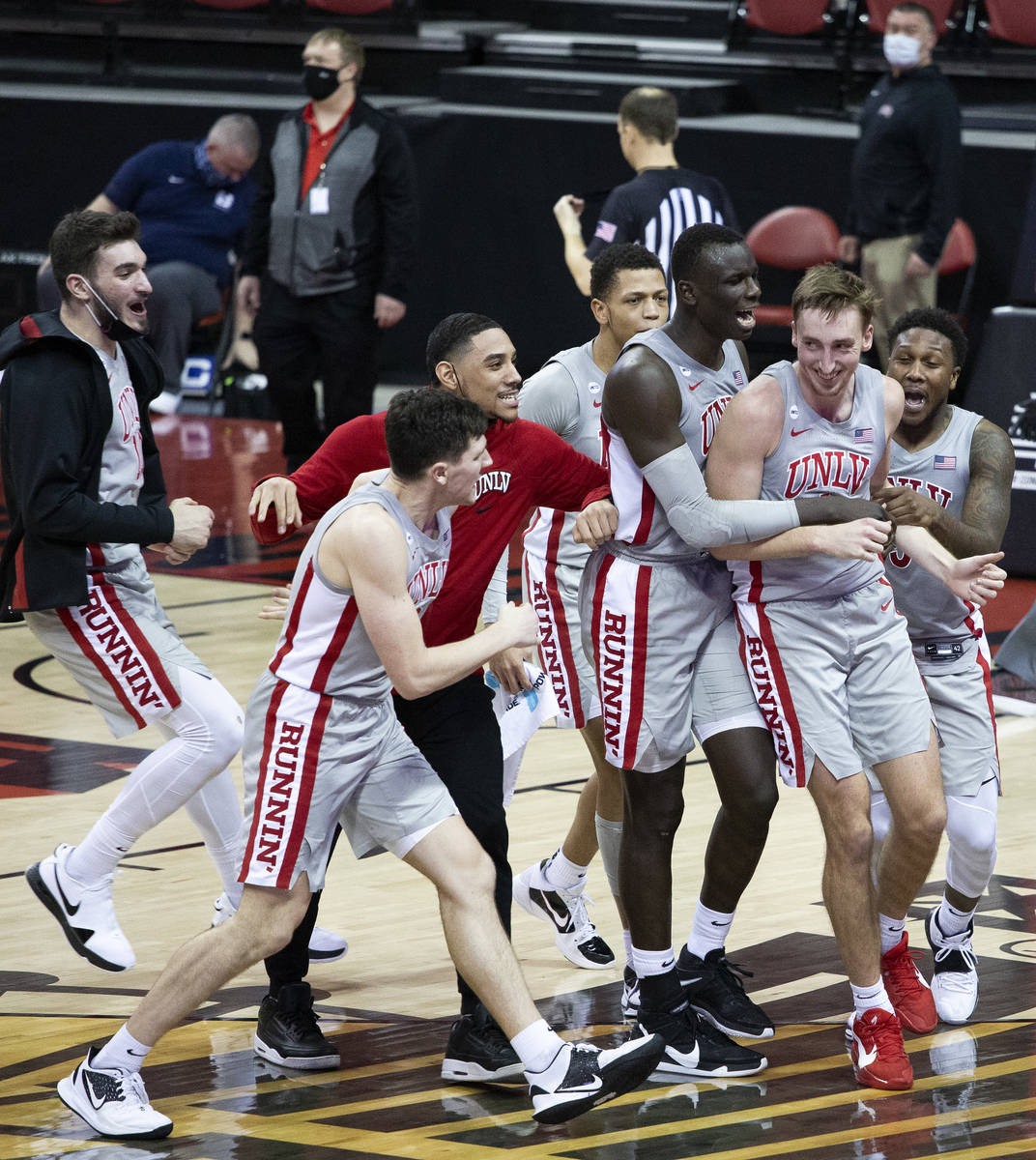 UNLV celebrates after winning the game 59-56 against the Utah State Aggie's at the Thomas & ...