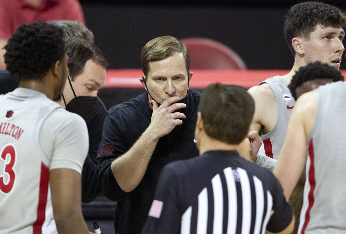 UNLV's head coach T. J. Otzelberger communicates with a referee during the second half of a bas ...