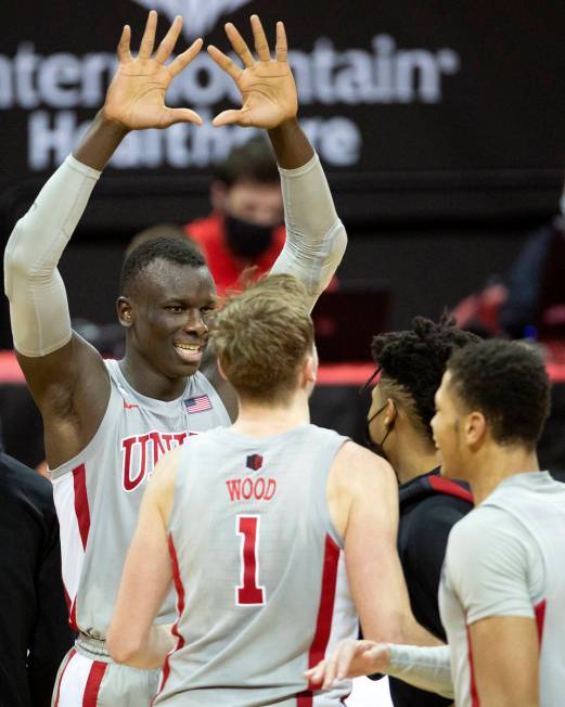 UNLV's forward Cheikh Mbacke Diong (34) reaches to high five his teammates after winning a bask ...
