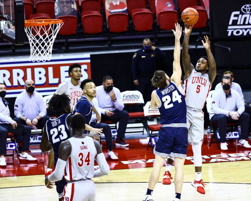 UNLV Rebels guard David Jenkins Jr. (5) shoots over Utah State Aggies guard Rollie Worster (24) ...