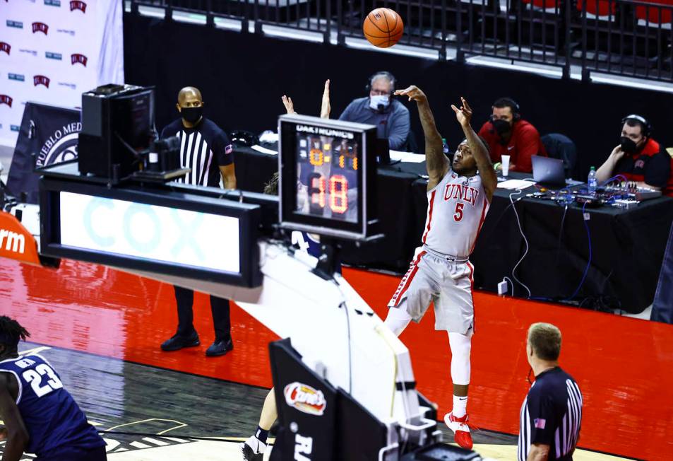 UNLV Rebels guard David Jenkins Jr. (5) shoots against the Utah State Aggies during the second ...