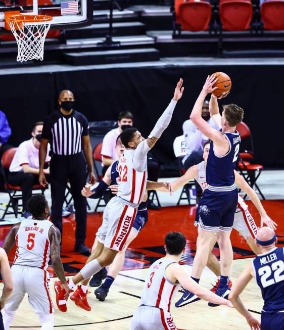 UNLV Rebels guard Nicquel Blake (22) tries to block a shot from Utah State Aggies guard Sean Ba ...