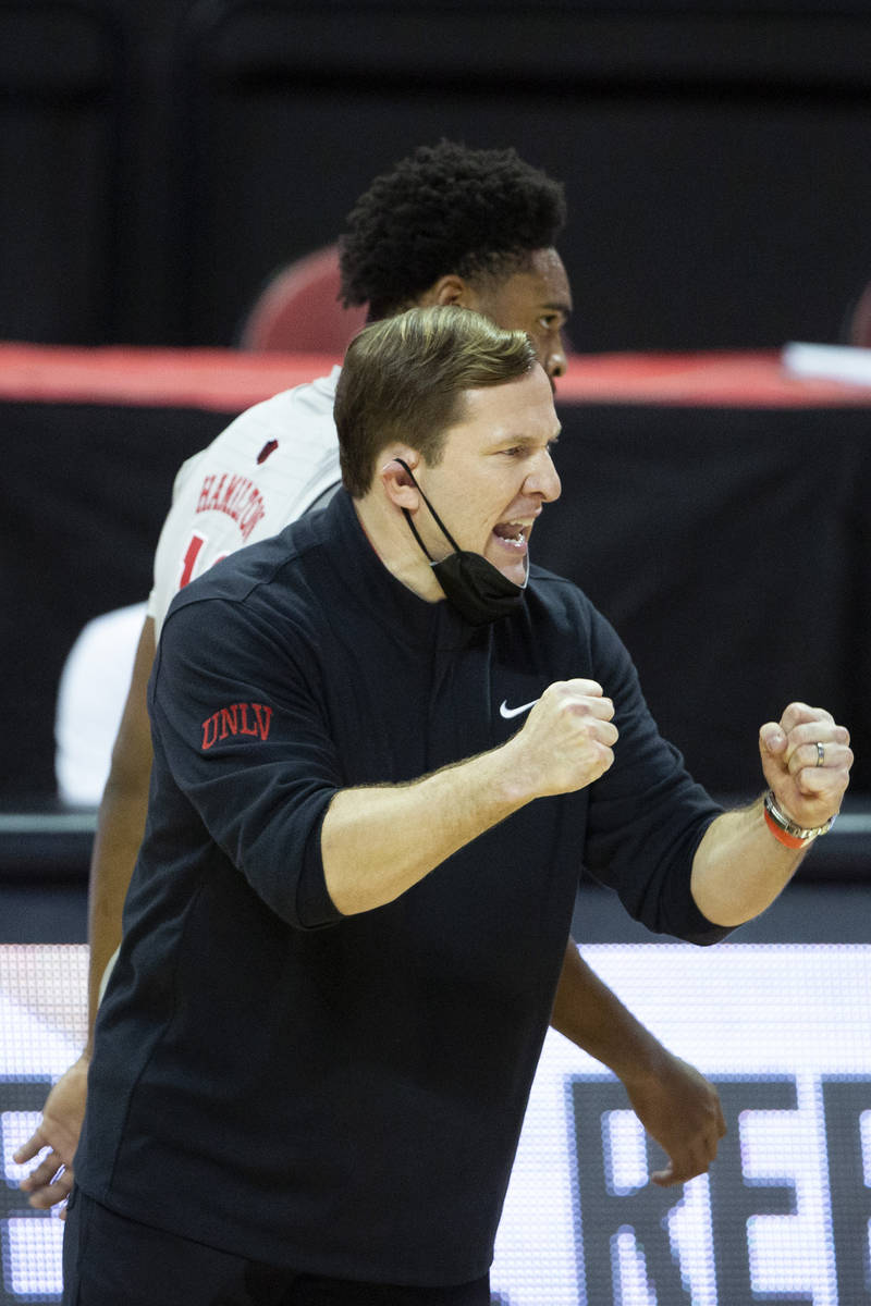 UNLV head coach T. J. Otzelberger encourages the team during the second half of a basketball ga ...