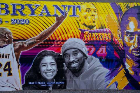A mural of Kobe and Gianna Bryant, created by Eric Meidenbauer, outside of Candid Worldwide at ...