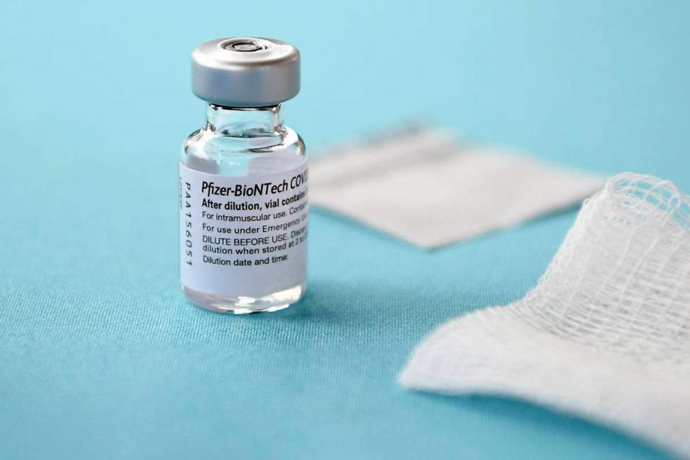 In a Monday, Dec. 14, 2020, file photo, a vial of the Pfizer-BioNTech vaccine for COVID-19 sits ...